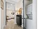 Hallway with laundry closet and open view to a living area with a stylish white sofa at 2067 Telfair Circle # A&B, Atlanta, GA 30324