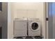 Functional laundry room with washer, dryer, and overhead wire shelving at 2067 Telfair Circle # A&B, Atlanta, GA 30324