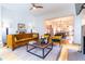 Inviting living room featuring hardwood floors, a stylish velvet sofa, and an open layout to the kitchen at 2067 Telfair Circle # A&B, Atlanta, GA 30324