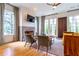 Bright living room featuring a fireplace, hardwood floors, and large windows for natural light at 2067 Telfair Circle # A&B, Atlanta, GA 30324