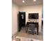 Office space with a desk, chair, and a mounted TV, next to a doorway to a powder room at 2067 Telfair Circle # A&B, Atlanta, GA 30324