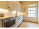 Pantry features white cabinetry, stainless microwave, and hardwood flooring at 2067 Telfair Circle # A&B, Atlanta, GA 30324