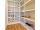 Spacious walk-in pantry with open shelving and hardwood flooring at 2067 Telfair Circle # A&B, Atlanta, GA 30324