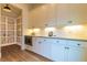 Pantry with white cabinets, shelving, stainless steel microwave, and hardwood flooring at 2067 Telfair Circle # A&B, Atlanta, GA 30324