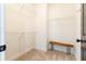 Spacious walk-in closet with ample shelving and a wooden bench for added convenience at 2067 Telfair Circle # A&B, Atlanta, GA 30324