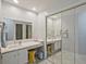 Double vanity bathroom featuring a huge mirror, double sinks and mirrored sliding closet doors at 212 Abingdon Way, Atlanta, GA 30328