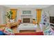 Bright living room features a decorative fireplace, modern furniture, and hardwood floors at 212 Abingdon Way, Atlanta, GA 30328