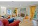 Comfortable living room featuring a fireplace, and plenty of natural light at 212 Abingdon Way, Atlanta, GA 30328