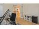 Well-lit home office with stylish decor, opening to other living spaces through elegant glass doors at 212 Abingdon Way, Atlanta, GA 30328