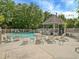 Relaxing community pool area with lounge chairs, tables, and a charming gazebo for shade at 212 Abingdon Way, Atlanta, GA 30328