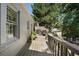 Outdoor deck featuring a grill, dining area, and a scenic view of the lush greenery at 414 E Wesley Ne Rd, Atlanta, GA 30305