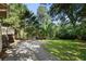 Expansive backyard with a patio, lawn, mature trees and plenty of space for outdoor activities at 414 E Wesley Ne Rd, Atlanta, GA 30305
