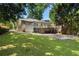Expansive backyard showcasing a lush lawn, mature trees, and a lovely deck accessible from the home's rear at 414 E Wesley Ne Rd, Atlanta, GA 30305