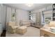 Cozy Bedroom featuring ample storage, a comfortable chair, and soft natural light at 414 E Wesley Ne Rd, Atlanta, GA 30305