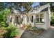 Side view of a charming home with lush landscaping, featuring well-maintained greenery and beautiful flower boxes at 414 E Wesley Ne Rd, Atlanta, GA 30305