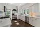 Kitchen featuring stainless steel appliances, white cabinets, hardwood floors, and marble countertops at 414 E Wesley Ne Rd, Atlanta, GA 30305