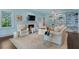 Bright and airy living room featuring a fireplace, custom shelving, and stylish decor at 414 E Wesley Ne Rd, Atlanta, GA 30305