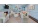 Elegant living room featuring a cozy fireplace, custom built-in shelving, and refined décor at 414 E Wesley Ne Rd, Atlanta, GA 30305