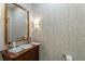 Charming powder room with custom wallpaper, beautiful fixtures, and a wood vanity at 414 E Wesley Ne Rd, Atlanta, GA 30305