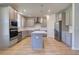 Well-equipped kitchen featuring stainless steel appliances, gray cabinets, and a center island at 136 Dalston Cv, Stockbridge, GA 30281