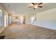 Open-concept living area with hardwood floors that flows seamlessly into the kitchen area at 136 Dalston Cv, Stockbridge, GA 30281