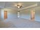 Large main bedroom with carpet, multiple doorways, and neutral decor for a relaxing retreat at 136 Dalston Cv, Stockbridge, GA 30281