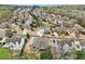 A home is centrally located in a neighborhood with tree coverage, and well-kept lawns at 1870 Marcia Overlook Dr, Cumming, GA 30041