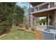 Charming backyard features a covered deck with access to a patio at 1870 Marcia Overlook Dr, Cumming, GA 30041