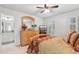 Bedroom with wood furniture, complemented by plantation shutters and adjoining bathroom at 1870 Marcia Overlook Dr, Cumming, GA 30041