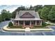 A beautiful clubhouse with covered porch, lush landscaping and convenient parking at 1870 Marcia Overlook Dr, Cumming, GA 30041