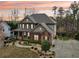 A two-story home with a landscaped yard and a driveway at 1870 Marcia Overlook Dr, Cumming, GA 30041