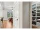 Hallway with pantry and a view into a den at 1870 Marcia Overlook Dr, Cumming, GA 30041