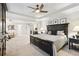 Large main bedroom with large bed, walk-in closet, trey ceiling, and fan at 1870 Marcia Overlook Dr, Cumming, GA 30041