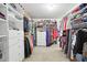 Spacious walk-in closet with custom shelving, hanging rods, and drawers for organized storage at 1870 Marcia Overlook Dr, Cumming, GA 30041