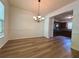 Classic dining room featuring modern wood-look floors and an elegant chandelier at 234 Silver Arrow Cir, Austell, GA 30168