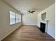 Bright living room boasting wood-look floors, a fireplace, and ample natural light at 234 Silver Arrow Cir, Austell, GA 30168