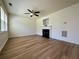 Bright living room featuring modern wood-look floors and a cozy fireplace at 234 Silver Arrow Cir, Austell, GA 30168