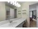 Bright, colorful bathroom with long vanity and open doorway to bedroom at 2772 Hillgrove Dr, Dacula, GA 30019