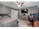 Comfortable bedroom with ceiling fan and a view of the backyard at 2772 Hillgrove Dr, Dacula, GA 30019