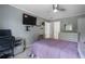 Bedroom with wall-mounted TV, gray walls, and ceiling fan at 2772 Hillgrove Dr, Dacula, GA 30019