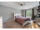 Bedroom with large window and neutral color palette at 2772 Hillgrove Dr, Dacula, GA 30019
