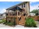 Outdoor deck featuring stairs, a roof covering, and a dark stained wood privacy fence at 2772 Hillgrove Dr, Dacula, GA 30019