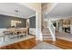 Elegant dining room featuring hardwood floors, a modern chandelier, and an open floor plan at 2772 Hillgrove Dr, Dacula, GA 30019