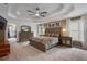 Spacious main bedroom features a tray ceiling, ceiling fan, and a soothing color palette at 2772 Hillgrove Dr, Dacula, GA 30019