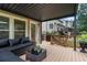 Spacious covered patio with a nice seating area and beautiful backyard at 2772 Hillgrove Dr, Dacula, GA 30019