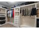 This walk-in closet has custom shelving, rods, and drawers for optimal organization and storage at 2772 Hillgrove Dr, Dacula, GA 30019