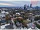 An elevated view showcases the homes and trees against the urban backdrop of the city at 549 Ne Parkway Ne Dr, Atlanta, GA 30308