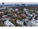 A wide aerial view highlights the residential area with the city skyline in the background at 549 Ne Parkway Ne Dr, Atlanta, GA 30308