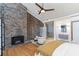 Bedroom with an ensuite bathroom featuring a fireplace and a soaking tub at 549 Ne Parkway Ne Dr, Atlanta, GA 30308
