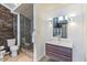 Modern bathroom featuring a glass shower, toilet, and a floating wood vanity at 549 Ne Parkway Ne Dr, Atlanta, GA 30308
